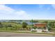Picturesque community view featuring a lake and picnic pavilion under a bright blue sky at 6737 S White Crow Way, Aurora, CO 80016