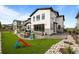 Beautiful backyard featuring an outdoor seating area, artificial turf, and a slide at 6737 S White Crow Way, Aurora, CO 80016
