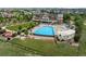 Resort-style community pool area surrounded by lush greenery, lounge seating, and Gathering-friendly amenities at 6737 S White Crow Way, Aurora, CO 80016