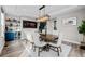 Dining room features large table, elegant chandelier, beverage bar, and stylish decor at 6737 S White Crow Way, Aurora, CO 80016