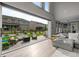 Open living room with access to the patio, offering seamless indoor-outdoor living and dining at 6737 S White Crow Way, Aurora, CO 80016