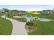 Community playground with vibrant play structures, a gazebo, walking path, and lush green space at 6737 S White Crow Way, Aurora, CO 80016