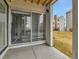 Balcony view with sliding glass doors and view of the community buildings at 3432 S Locust St # A, Denver, CO 80222