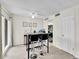 Cozy dining area featuring a modern table with bar stools and view into the kitchen at 3432 S Locust St # A, Denver, CO 80222