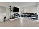 Cozy living room with modern decor, gray sofa, sleek furniture, and bright natural light at 3432 S Locust St # A, Denver, CO 80222