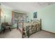 Cozy bedroom features a wrought iron bed frame and a window with natural light at 8223 Kincross Way, Boulder, CO 80301