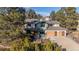 Charming two-story home with a three-car garage and beautiful landscaping in front at 8223 Kincross Way, Boulder, CO 80301