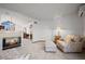 Living room with fireplace, neutral palette, and connecting spaces at 8223 Kincross Way, Boulder, CO 80301