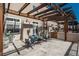 Back patio with a pergola, outdoor furniture and chairs, ideal for relaxing and entertaining guests at 880 E 16Th Ave # D, Denver, CO 80218