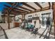 Back patio with a pergola, outdoor furniture and chairs, ideal for relaxing and entertaining guests at 880 E 16Th Ave # D, Denver, CO 80218
