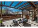Back patio with a pergola, outdoor furniture and chairs, ideal for relaxing and entertaining guests at 880 E 16Th Ave # D, Denver, CO 80218