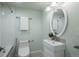 Bright bathroom featuring sleek fixtures, a modern vanity, and tiled shower with built in seat at 880 E 16Th Ave # D, Denver, CO 80218