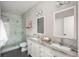 This is a beautifully renovated bathroom with a glass shower, double sinks, and modern fixtures at 880 E 16Th Ave # D, Denver, CO 80218