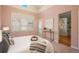 Bright bedroom boasts hardwood floors, neutral tones, and walk out to patio at 880 E 16Th Ave # D, Denver, CO 80218