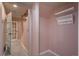 Hallway with light tile floors, coat hooks, and a staircase leading to upper level at 880 E 16Th Ave # D, Denver, CO 80218