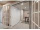 Hallway with tiled floors, doors leading to other rooms, and a desk visible through an opening at 880 E 16Th Ave # D, Denver, CO 80218