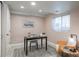 Cozy home office featuring a minimalist desk, comfortable seating, and natural light from the window at 880 E 16Th Ave # D, Denver, CO 80218