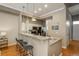 Stylish kitchen bar featuring pendant lighting, granite countertops, stainless steel appliances, and bar stool seating at 880 E 16Th Ave # D, Denver, CO 80218
