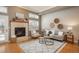 Bright living room boasts hardwood floors, fireplace, and neutral tones, creating a warm and inviting atmosphere at 880 E 16Th Ave # D, Denver, CO 80218