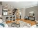 Open-concept living room featuring hardwood floors, bar seating, and neutral tones, perfect for entertaining at 880 E 16Th Ave # D, Denver, CO 80218