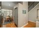 Dining area with natural light, hardwood floors, and seating for four near the staircase at 880 E 16Th Ave # D, Denver, CO 80218