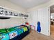 Bedroom featuring a bunk bed, closet, and light colored walls at 3155 Kedleston Ave, Highlands Ranch, CO 80126