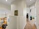 Second floor landing featuring hallway and access to rooms at 3155 Kedleston Ave, Highlands Ranch, CO 80126
