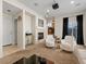 Open-concept living area with a fireplace, comfortable seating, and easy access to other rooms at 3155 Kedleston Ave, Highlands Ranch, CO 80126