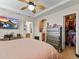 Bright and spacious main bedroom with a large bed, TV and a view to walk-in closet and bathroom at 3155 Kedleston Ave, Highlands Ranch, CO 80126