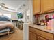 Comfortable main bedroom with a large bed, TV, walk-in shower and built-in countertop space at 3155 Kedleston Ave, Highlands Ranch, CO 80126