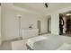 Bright bedroom with minimalist design, a ceiling fan, and a walk-in closet with shelving at 1750 Wewatta St # 834, Denver, CO 80202