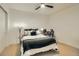 Bedroom with a ceiling fan, a comfortable bed, and a cozy workspace setup at 1750 Wewatta St # 834, Denver, CO 80202