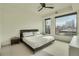 Serene bedroom with city views, neutral tones, and a comfortable king-sized bed at 1750 Wewatta St # 834, Denver, CO 80202