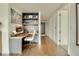 Bright office with hardwood floors, built-in shelving, and sleek modern design at 1750 Wewatta St # 834, Denver, CO 80202