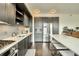 Kitchen features an island with seating, stainless steel appliances, and ample cabinet space at 1750 Wewatta St # 834, Denver, CO 80202