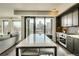 Open concept living space features a kitchen with an island and views of the city skyline at 1750 Wewatta St # 834, Denver, CO 80202