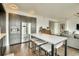 Kitchen with stainless steel appliances, a central island with seating, and open layout at 1750 Wewatta St # 834, Denver, CO 80202