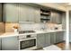 Stylish kitchen showcases modern gray cabinets, stainless steel oven, and sleek countertops at 1750 Wewatta St # 834, Denver, CO 80202
