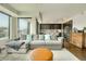This living room flows into the kitchen, and boasts a soft area rug and comfortable seating at 1750 Wewatta St # 834, Denver, CO 80202
