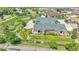 Aerial view of a home showcasing manicured lawns, lush landscaping, and surrounding neighborhood at 12444 Madison Way, Thornton, CO 80241