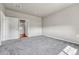 Neutral toned bathroom with tile and walk in shower through a door at 12444 Madison Way, Thornton, CO 80241