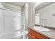 Bathroom with a bath and shower combination, tiled walls, and a sink with vanity at 12444 Madison Way, Thornton, CO 80241