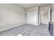 Spacious bedroom with soft carpet and a closet with sliding doors at 12444 Madison Way, Thornton, CO 80241