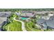 Aerial view of community pool surrounded by trees and winding walkways at 12444 Madison Way, Thornton, CO 80241