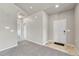 Entryway showcases a clean design with neutral tones, carpeted flooring, and access to main living areas at 12444 Madison Way, Thornton, CO 80241