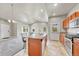 Spacious kitchen featuring stainless steel appliances and a central island for food preparation at 12444 Madison Way, Thornton, CO 80241