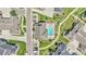 Aerial shot of a community pool with lounge chairs, and lush landscaping at 12444 Madison Way, Thornton, CO 80241