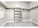 Well-organized walk-in closet with ample shelving, bars, and a clean, neutral color scheme at 12444 Madison Way, Thornton, CO 80241