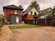 Spacious backyard with a mix of gravel, grass, and a wooden fence, perfect for outdoor activities at 2631 W 34Th Ave, Denver, CO 80211