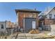 Backyard with a construction project underway on the exterior elevation of the home at 2631 W 34Th Ave, Denver, CO 80211